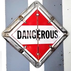 Authentic semi-trailer rear door flaps sign that warns of what's inside